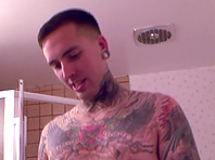 Tattooed gay soaps his dick in a bathroom and masturbates