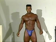 Muscular black stud pleases himself with masturbation indoors