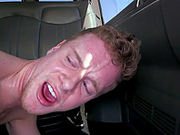 Redhead homo lets a twink fuck his mouth and ass in a car
